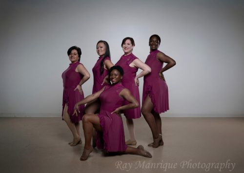 Desueño team members pose in berry Perception costumes